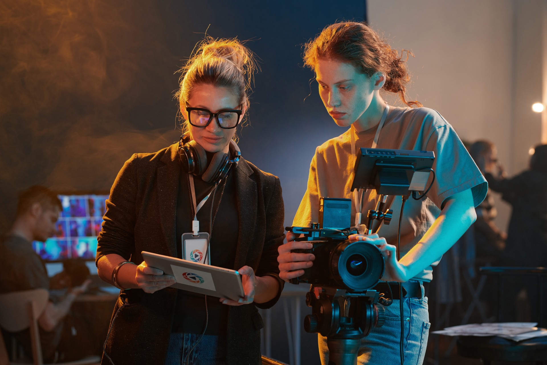 Two Women Working in Video Production And Using Tablet